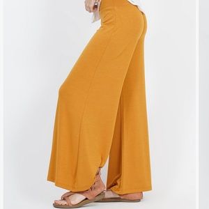 Mustard ankle length palazzo pants.